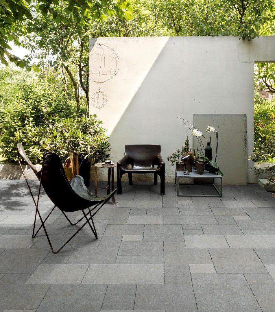 French pattern porcelain pavers installed in a garden patio layout