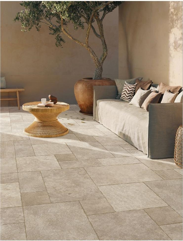 Navona Almond porcelain slabs installed in a villa courtyard landscape